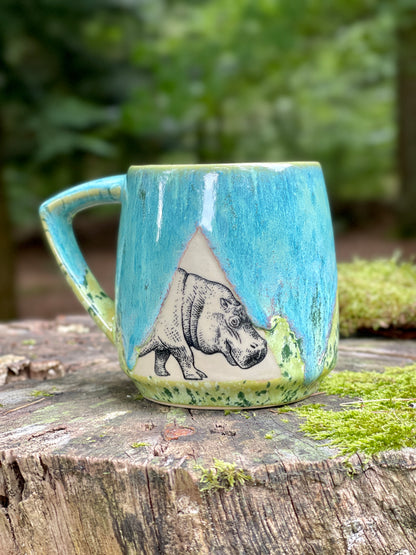 Green mug with hippopotamus